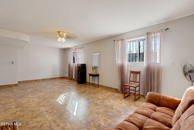 3705 Roslyn Dr, Horizon City, TX 79928 - living room with a textured ceiling and baseboards