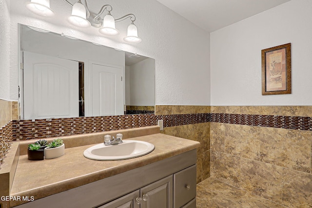 3705 Roslyn Dr, Horizon City, TX 79928 - bathroom with vanity and tile walls