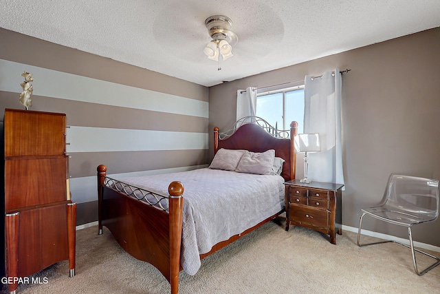 3705 Roslyn Dr, Horizon City, TX 79928 - bedroom featuring a textured ceiling, light carpet, baseboards, and ceiling fan