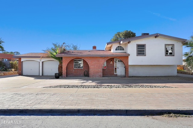 3705 Roslyn Dr, Horizon City, TX 79928 - tri-level home featuring brick siding, a chimney, central AC, and driveway