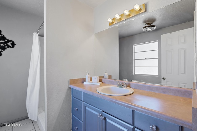 3705 Roslyn Dr, Horizon City, TX 79928 - full bath featuring tile patterned floors, vanity, and a shower with shower curtain