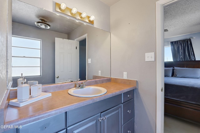 3705 Roslyn Dr, Horizon City, TX 79928 - bathroom featuring vanity and a textured ceiling