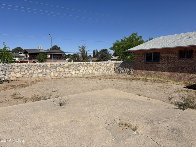 1604 Rick Rhodes Dr, El Paso, TX 79936 - view of yard featuring a patio and fence