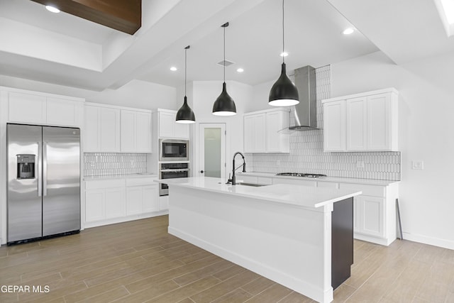 3792 Surmise St, El Paso, TX 79938 - kitchen featuring stainless steel appliances, a sink, wall chimney exhaust hood, light countertops, and decorative backsplash