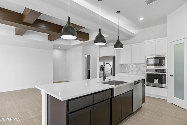 3792 Surmise St, El Paso, TX 79938 - kitchen with appliances with stainless steel finishes, a sink, light countertops, recessed lighting, and white cabinetry