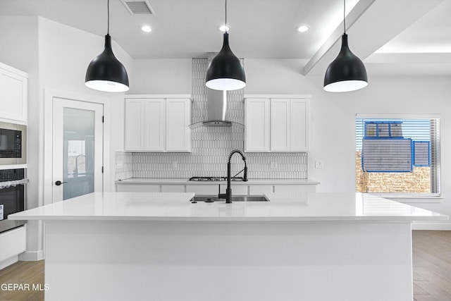 3792 Surmise St, El Paso, TX 79938 - kitchen with decorative backsplash, a sink, stainless steel appliances, light countertops, and white cabinetry
