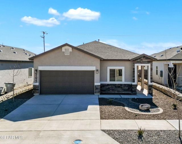 ranch-style home with a shingled roof, stone siding, a garage, concrete driveway, and stucco siding