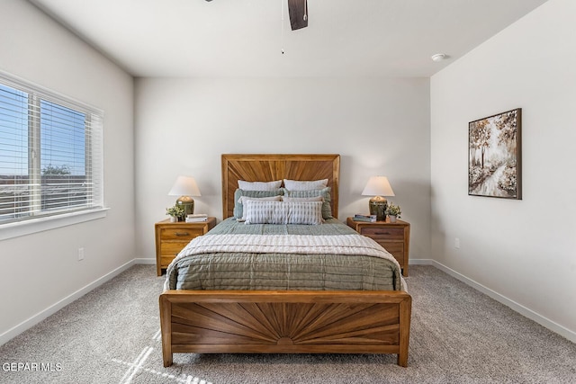 bedroom featuring light carpet, ceiling fan, and baseboards