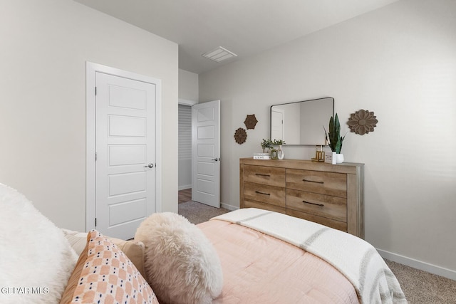 bedroom with carpet flooring, visible vents, and baseboards