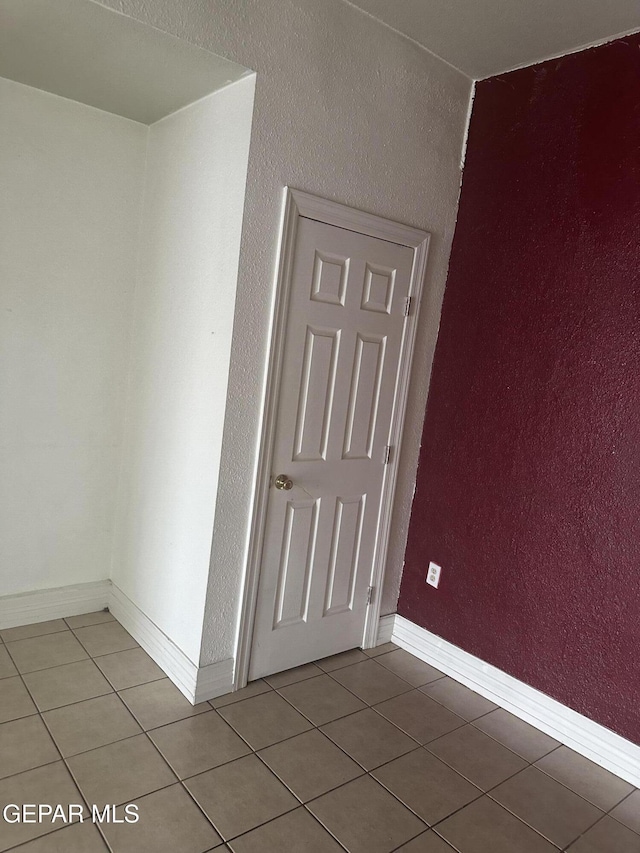 3506 Pera Ave Unit A & B, El Paso, TX 79905 - spare room with light tile patterned floors, baseboards, and a textured wall
