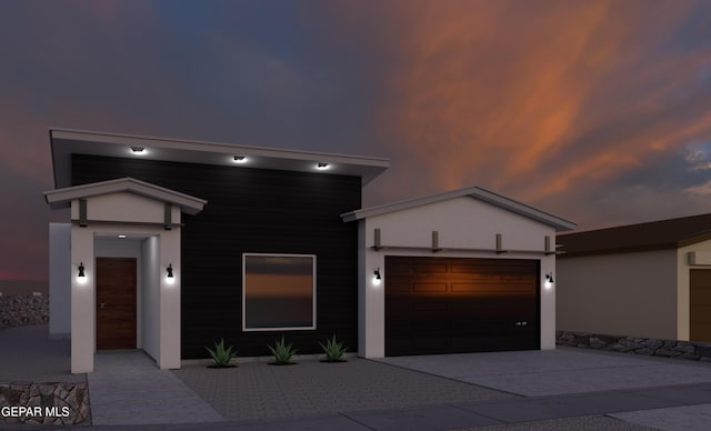 1413 Dylan Pl, El Paso, TX 79928 - contemporary house featuring an attached garage, stucco siding, and concrete driveway