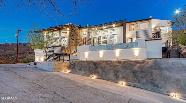 4108 Metetuye Ln, El Paso, TX 79902 - modern home featuring stucco siding and stairway