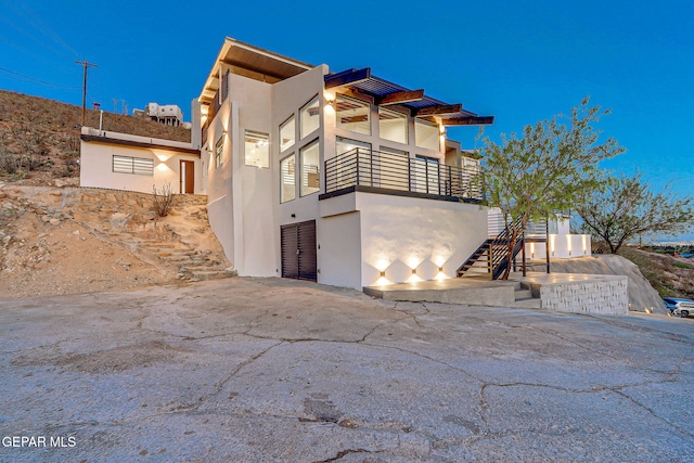 4108 Metetuye Ln, El Paso, TX 79902 - view of home's exterior featuring stairs and stucco siding