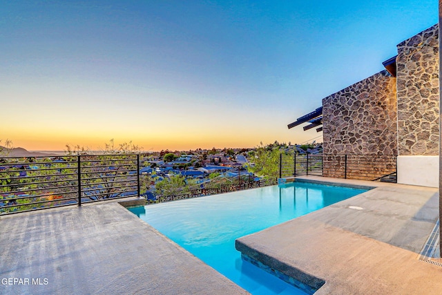 4108 Metetuye Ln, El Paso, TX 79902 - pool at dusk featuring an outdoor pool