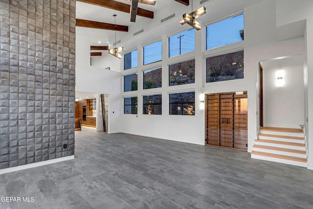 4108 Metetuye Ln, El Paso, TX 79902 - unfurnished living room with stairs, visible vents, a high ceiling, and beamed ceiling