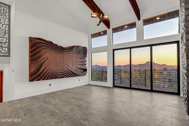 4108 Metetuye Ln, El Paso, TX 79902 - empty room with a mountain view, high vaulted ceiling, and beamed ceiling