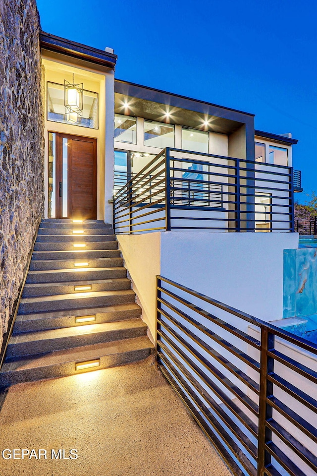 4108 Metetuye Ln, El Paso, TX 79902 - entrance to property with stucco siding and a balcony