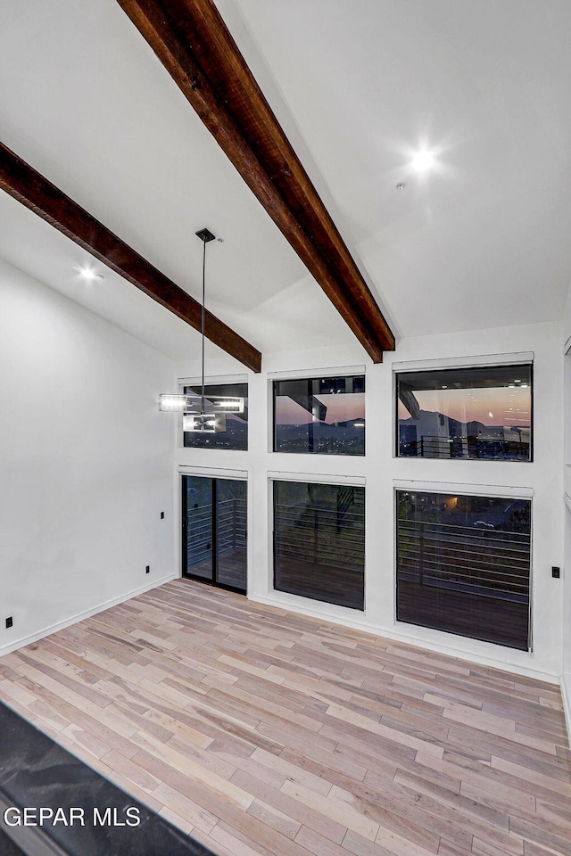 4108 Metetuye Ln, El Paso, TX 79902 - interior space with wood finished floors, beamed ceiling, and baseboards