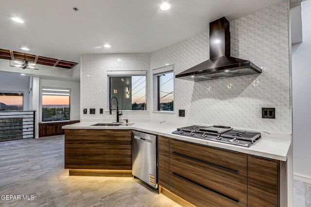 4108 Metetuye Ln, El Paso, TX 79902 - kitchen with a sink, wall chimney range hood, appliances with stainless steel finishes, and modern cabinets