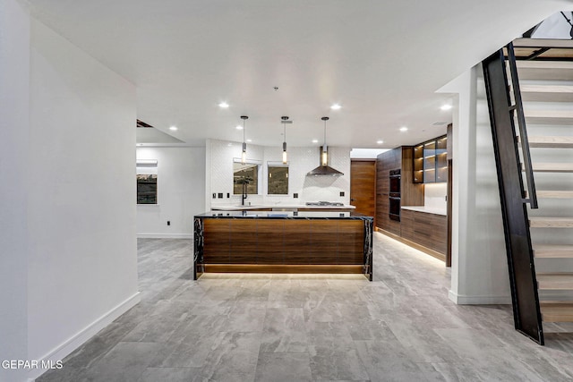 4108 Metetuye Ln, El Paso, TX 79902 - kitchen featuring wall chimney range hood, recessed lighting, backsplash, modern cabinets, and brown cabinetry