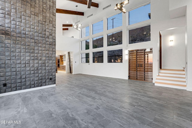 4108 Metetuye Ln, El Paso, TX 79902 - unfurnished living room with stairway, a high ceiling, and beamed ceiling