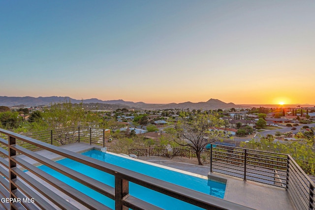 4108 Metetuye Ln, El Paso, TX 79902 - pool at dusk featuring a fenced in pool and a mountain view