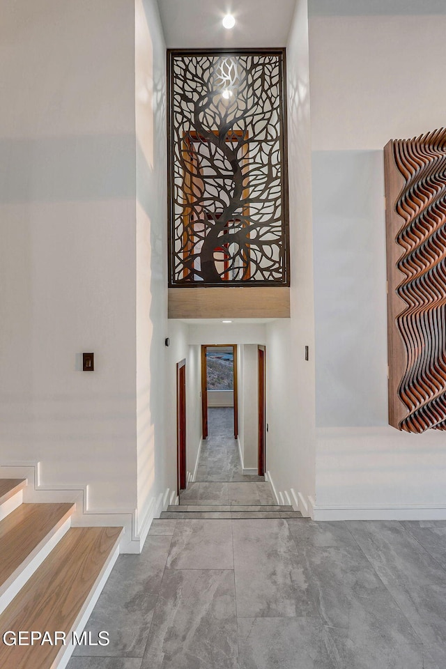 4108 Metetuye Ln, El Paso, TX 79902 - stairs featuring a high ceiling and baseboards