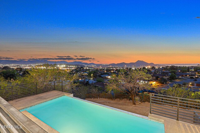4108 Metetuye Ln, El Paso, TX 79902 - view of pool with a mountain view and fence