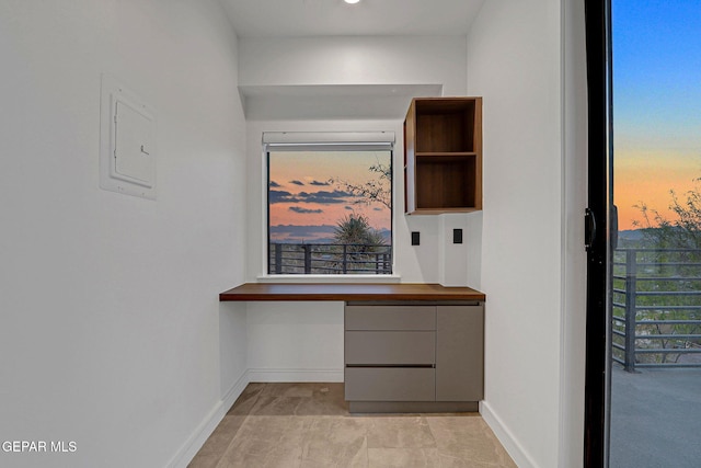 4108 Metetuye Ln, El Paso, TX 79902 - unfurnished office with built in desk, baseboards, and electric panel