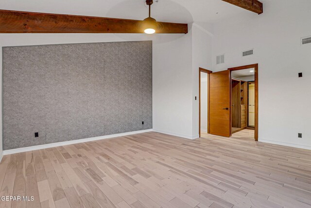 4108 Metetuye Ln, El Paso, TX 79902 - spare room featuring beamed ceiling, light wood finished floors, and visible vents