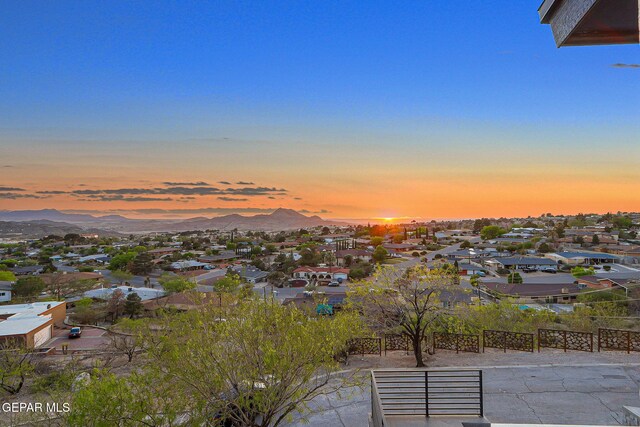 4108 Metetuye Ln, El Paso, TX 79902 - aerial view at dusk with a mountain view and a residential view