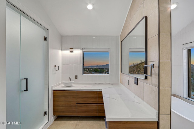 4108 Metetuye Ln, El Paso, TX 79902 - full bathroom with a stall shower, vanity, tile patterned flooring, and tile walls