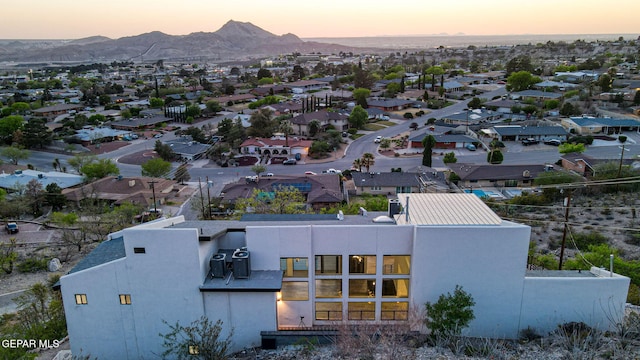 4108 Metetuye Ln, El Paso, TX 79902 - aerial view at dusk with a mountain view and a residential view