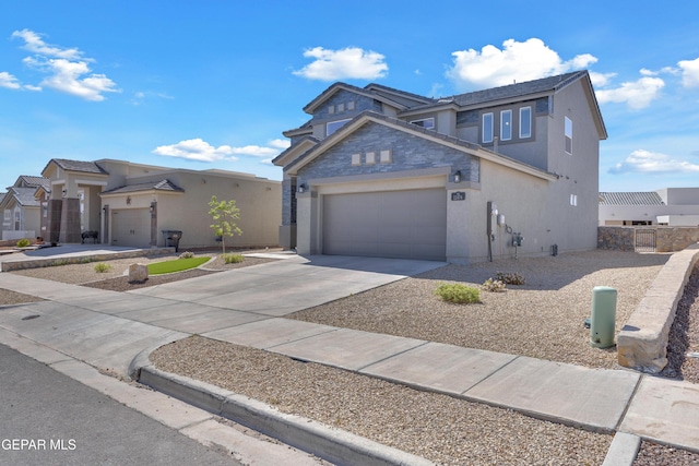 traditional home featuring an attached garage, driveway, and stucco siding