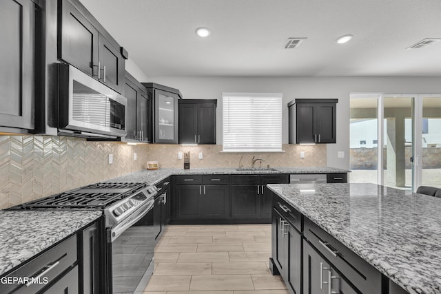 kitchen featuring plenty of natural light, visible vents, and stainless steel appliances