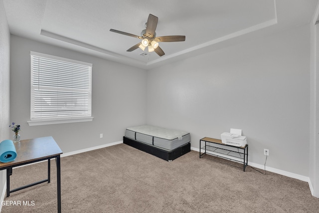 bedroom featuring a raised ceiling, carpet flooring, baseboards, and visible vents