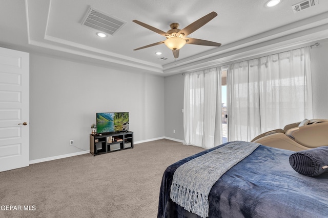 carpeted bedroom with visible vents, baseboards, recessed lighting, and a tray ceiling