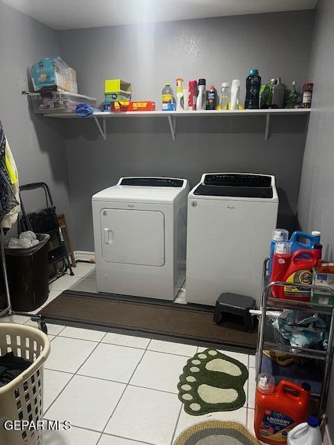 washroom featuring separate washer and dryer and tile patterned flooring