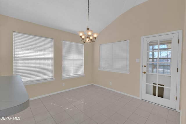 7341 Desierto Rojo Ct, El Paso, TX 79912 - unfurnished dining area featuring lofted ceiling, a chandelier, and baseboards