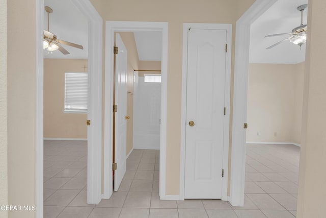7341 Desierto Rojo Ct, El Paso, TX 79912 - hallway featuring baseboards and light tile patterned floors