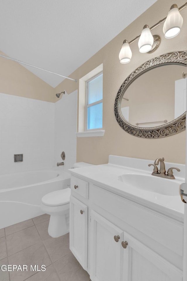 7341 Desierto Rojo Ct, El Paso, TX 79912 - bathroom with vanity,  shower combination, toilet, lofted ceiling, and tile patterned flooring