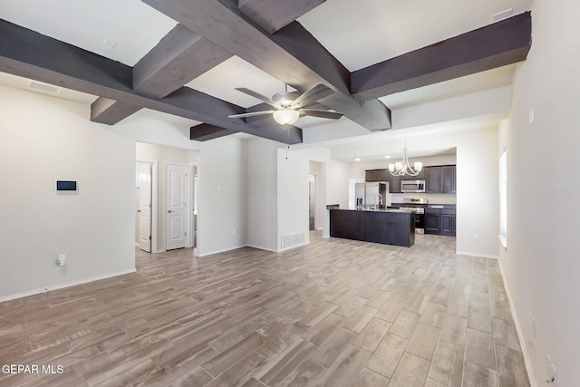 unfurnished living room featuring visible vents, baseboards, light wood-style floors, beam ceiling, and ceiling fan with notable chandelier