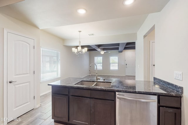 kitchen with dark stone counters, dark brown cabinetry, visible vents, dishwasher, and a sink