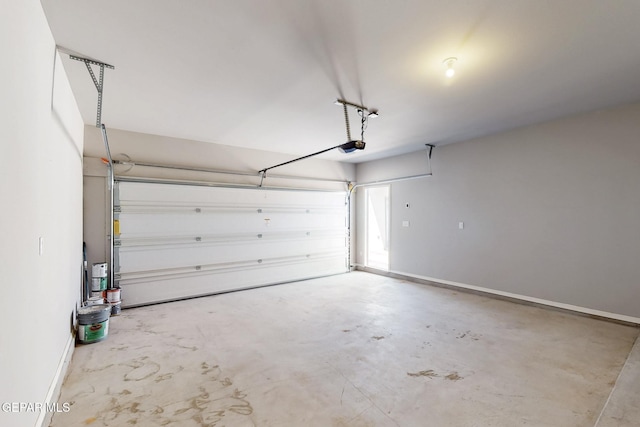 garage featuring baseboards and a garage door opener