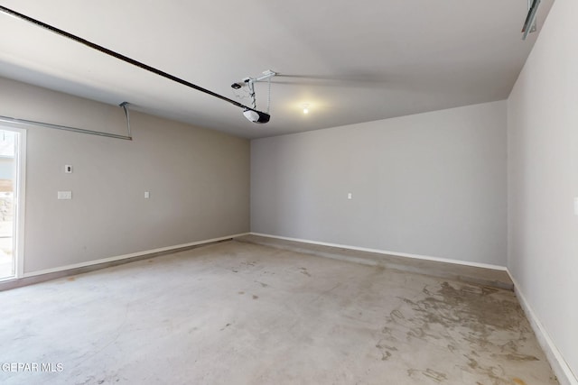 garage featuring baseboards and a garage door opener