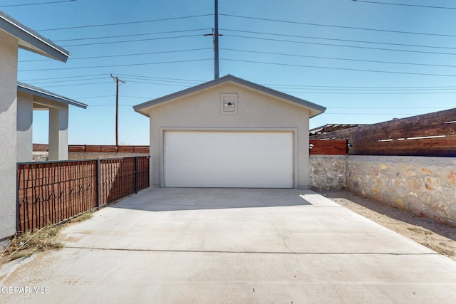 detached garage with fence