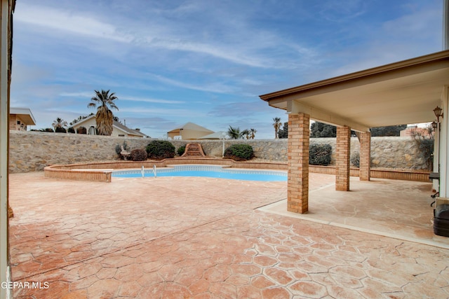view of pool with a patio, a fenced backyard, and a fenced in pool