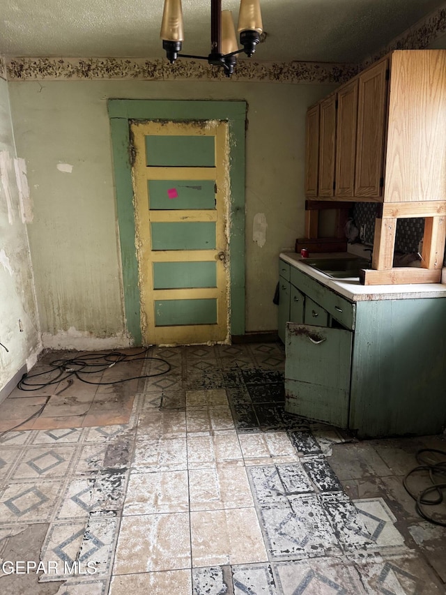 kitchen with a sink and light countertops