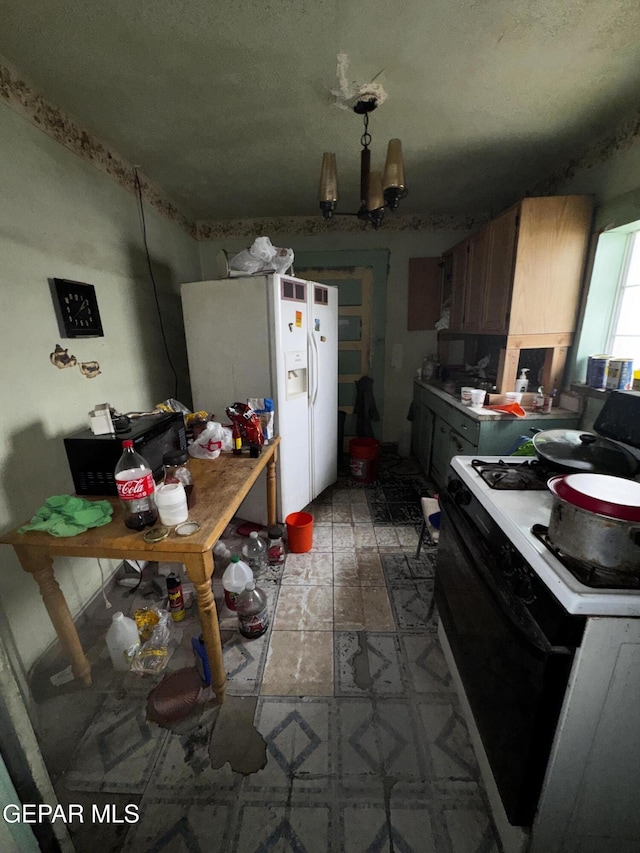 kitchen with light countertops, white refrigerator with ice dispenser, electric range, and a textured ceiling