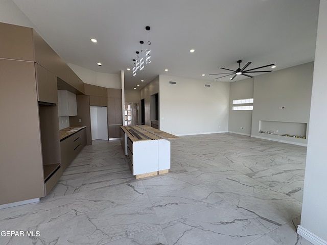 11345 Ardelle Ave, El Paso, TX 79936 - kitchen with marble finish floor, ceiling fan, modern cabinets, and recessed lighting